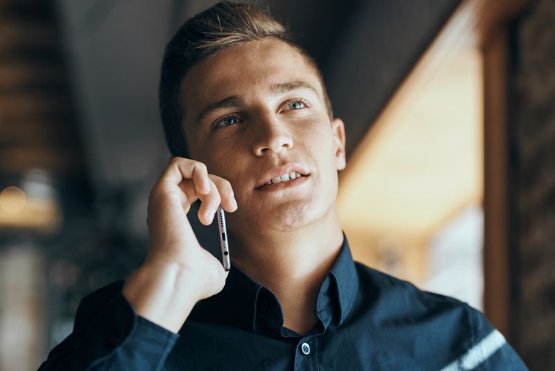 young white man on a phone call