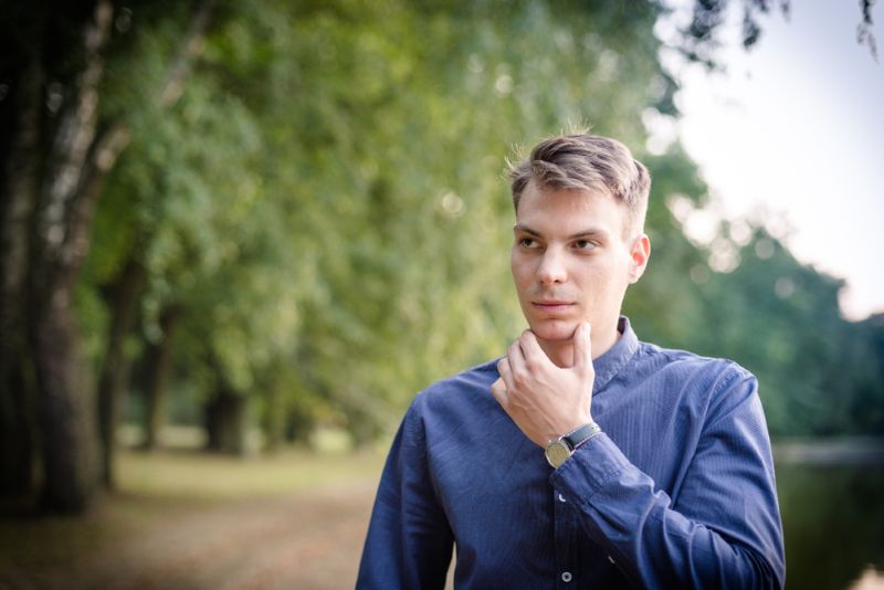 man in deep thought holding his chin