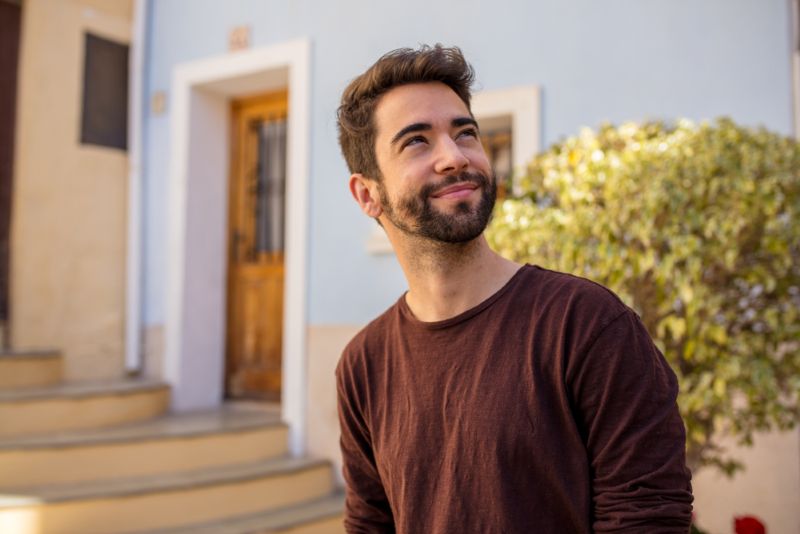 Man looking into distance with confident smile on his face