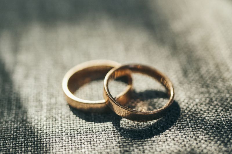Two weddings rings overlapping on fabric